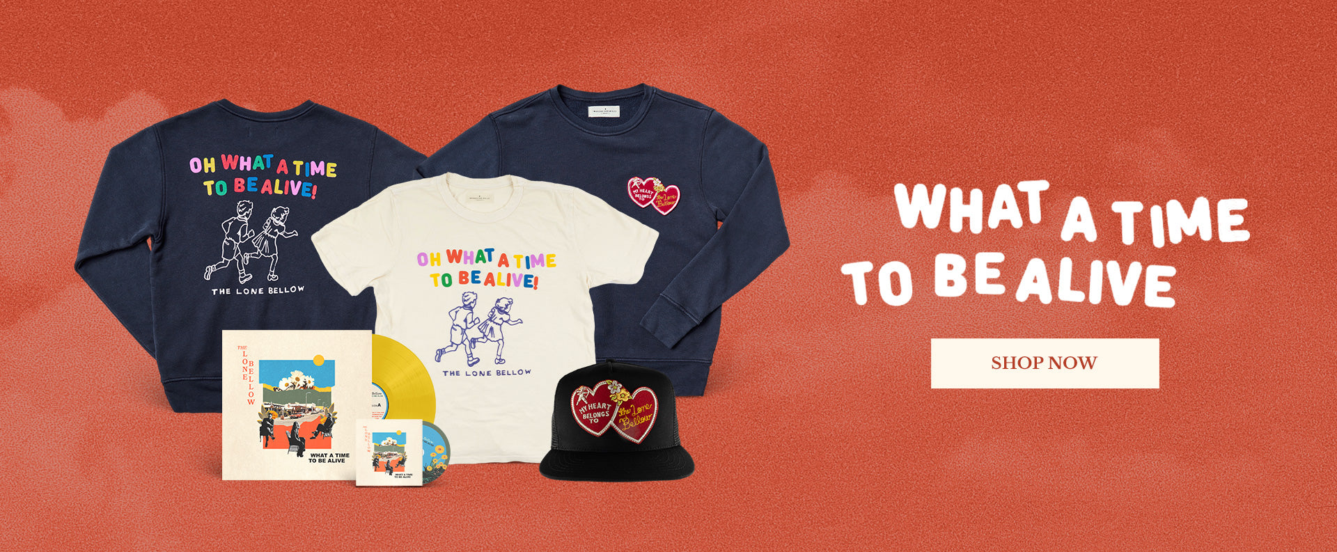 Collection of merchandise with 'What a Time to be Alive' text on a red background